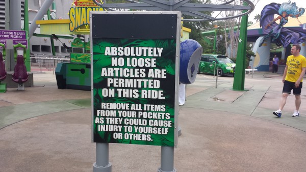 A sign out front of the The Incredible Hulk roller coaster directors park patrons to remove all loose articles before entering the queue line. / 20141114_090807.jpg 20141114_090807.jpg